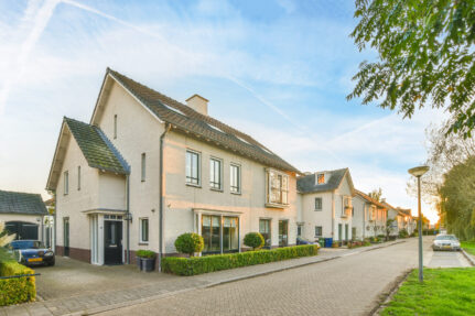 a row of houses on the side of a street